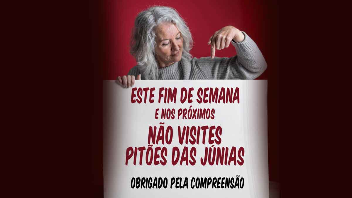 Senhora a segurar cartaz com a inscrição "Não visites Pitões das Júnias"